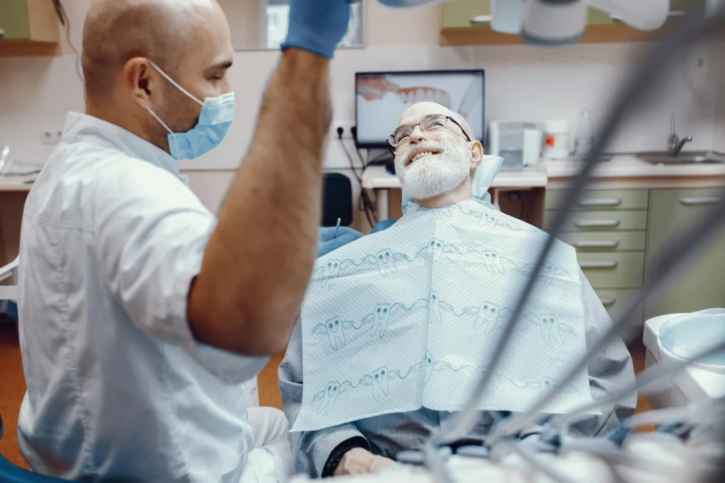 Senior dental checkup with dental implants in Sydney at a modern clinic